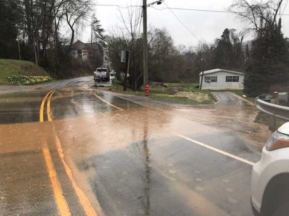 Muddy water flows down the access road to the Millennial Apartments project during a     rain event Feb. 24. Jackson County photo