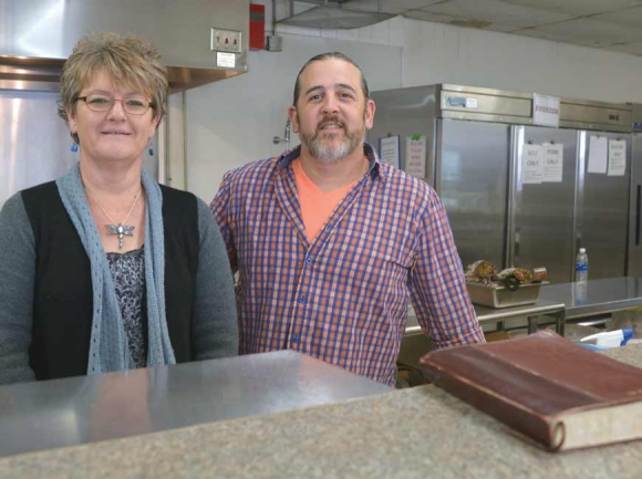 Executive Director Allison Jennings (left) and husband Chris stand behind the counter at The Canton Community Kitchen. Cory Vaillancourt photo