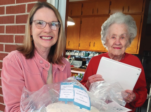 Mary Polanski, one of the chairs of the Macon County Women’s History Trail project, honors Dot Crawford with the Macon Matriarch Award for 2020. Donated photo