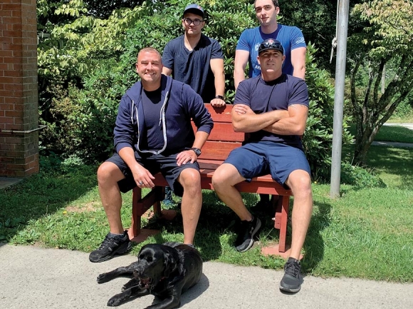 Service dog Denali pictured with firefighters at Station 7 in Asheville. Donated photo