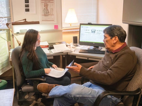Graduate student Constance Owl (left) and Cherokee language speaker Tom Belt                go over translations from the Cherokee Phoenix newspaper, which was published from about 1828 to 1834. WCU photo
